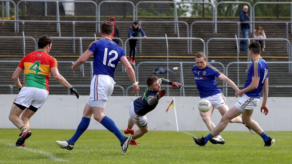 Patrick Fox scores a goal for Longford at Carlow. Photograph: Bryan Keane/Inpho