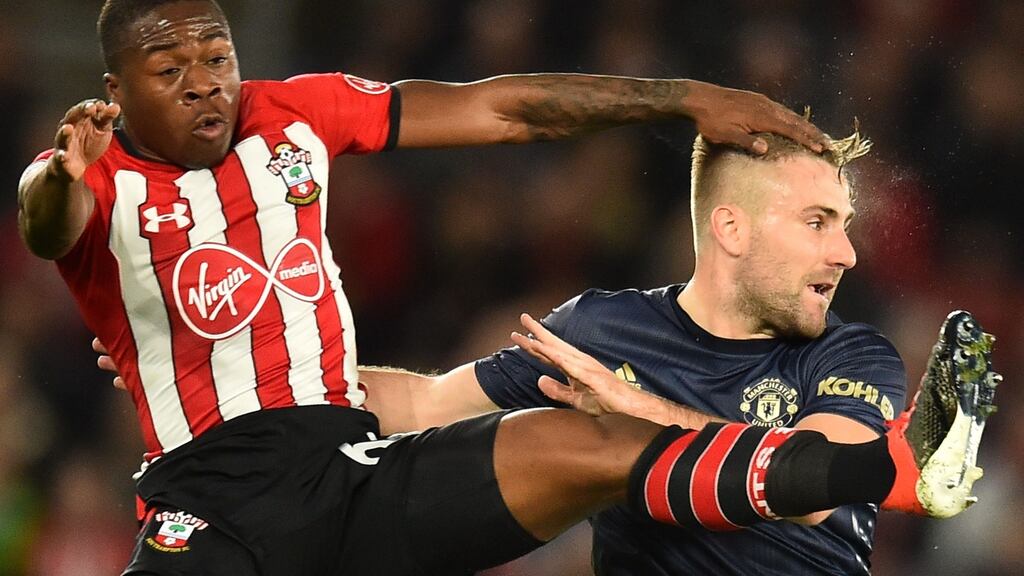 Southampton’s Irish striker Michael Obafemi tangles with Manchester United’s Luke Shaw. Photograph: Getty Images