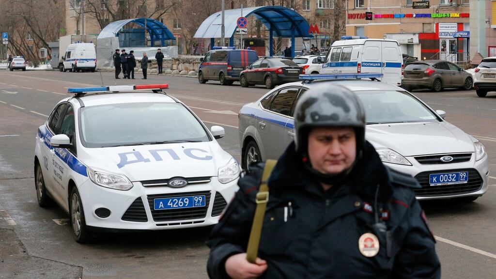 A Russian police officer stands at the site where a woman suspected of murdering a young child was arrested on Monday. Russian investigators said they had arrested a nanny and charged her with murdering a young child in her care. Photograph: Reuters
