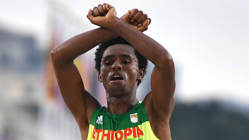 Olympic marathon silver medalist Feyisa Lilesa has been told he is safe to return home to Ethiopia. Photograph: Afp