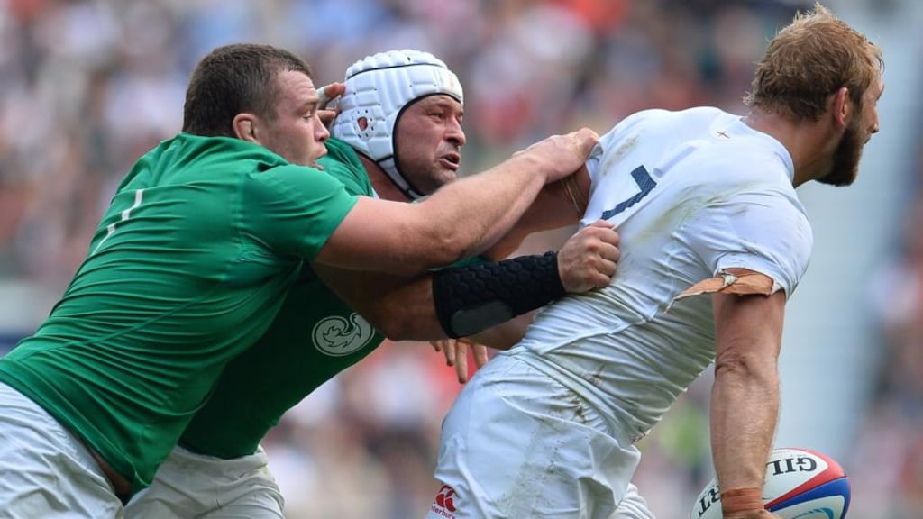 England’s flanker Chris Robshaw  is tackled by Ireland’s  Rory Best and   Jack McGrath  during Saturday’s Rugby World Cup warm-up match at Twickenham. Photograph: Glyn Kirk/AFP/Getty Images