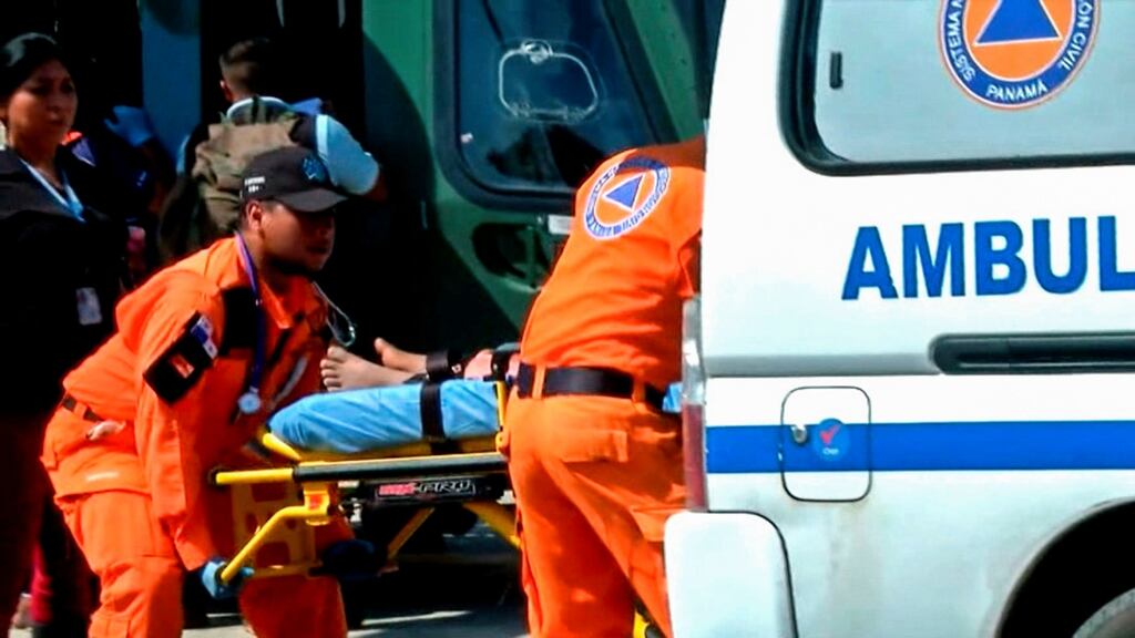 Panamanian paramedics carrying one of the 15 people rescued from a religious sect on a stretcher in Santiago, Veraguas province, Panama on Wednesday. Photograph: TVN Noticias/Getty Images