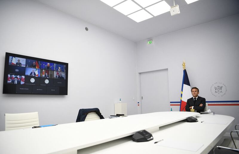 France's President Emmanuel Macron participates in a video conference with G7 leaders on the situation in Ukraine, at the Hotel Marigny in Paris on October 11, 2022. (Photo by Christophe ARCHAMBAULT / POOL / AFP) (Photo by CHRISTOPHE ARCHAMBAULT/POOL/AFP via Getty Images)