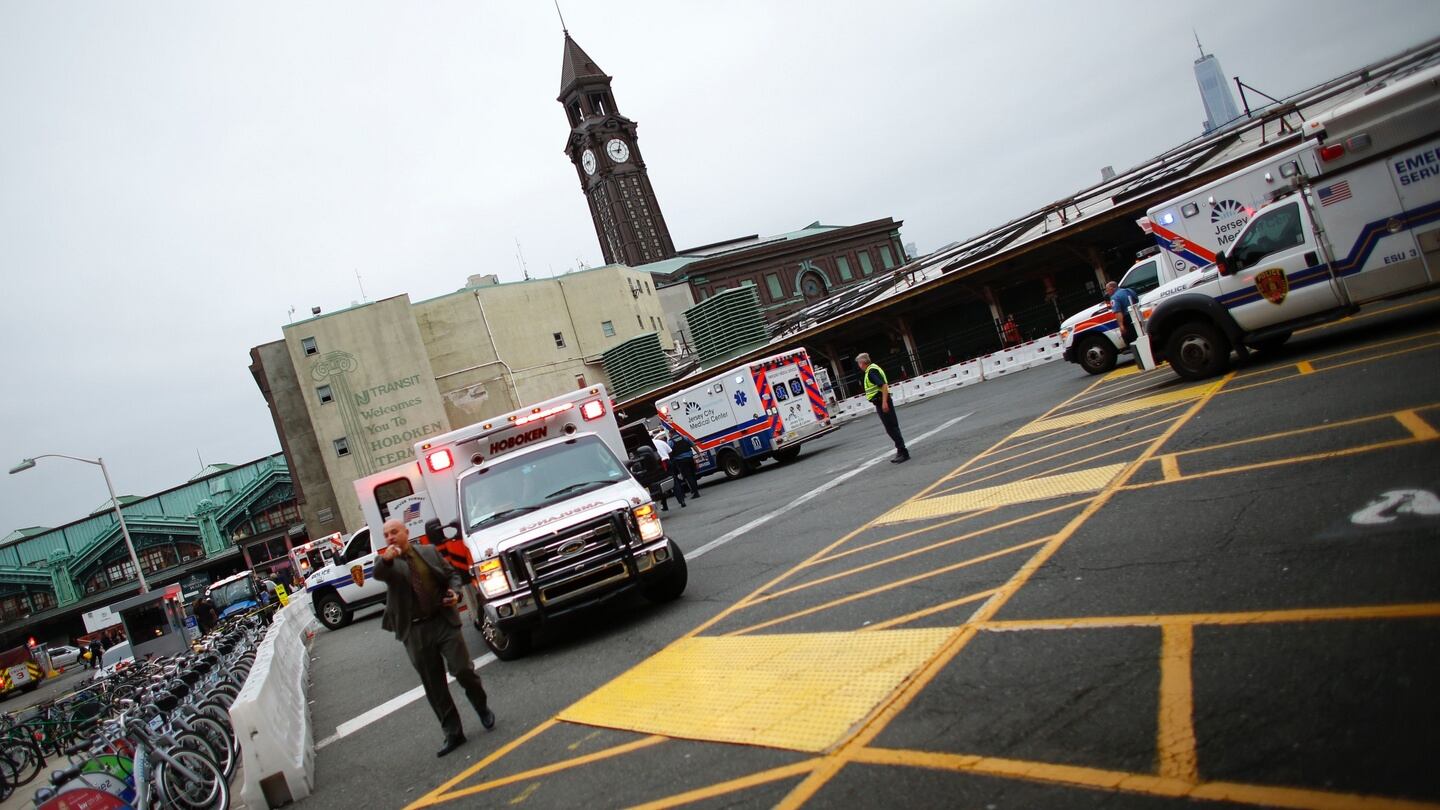 Emergency workers arrive at New Jersey Transit’s rail station in Hoboken, New Jersey. Photograph: Kena Betancur/AFP/Getty Images