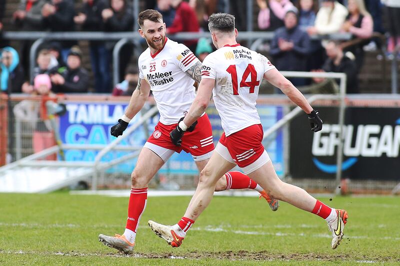 Tyrone's Ronan McNamee is congratulated by Mattie Donnelly after scoring a point against Armagh in March. Photograph: Lorcan Doherty/Inpho