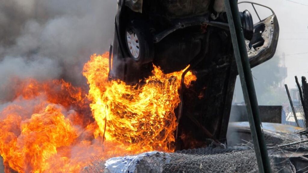 A vehicle burns at the scene of a car bomb attack in Baghdad’s Kadhimiya district today. A series of car bombs in Baghdad killed at least 28 people and wounded dozens. Photograph: Reuters.
