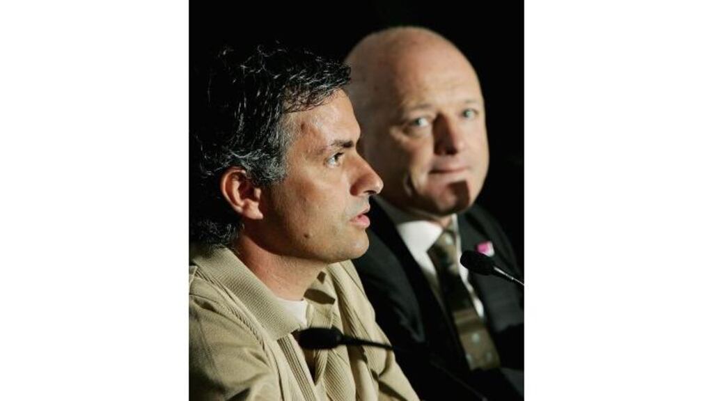 Jose Mourinho, left, was heartened last night when Chelsea chief
executive, Peter Kenyon, right, openly pledged owner Roman
Abramovich's backing for Mourinho's management. The manager warned,
however, he would not tolerate major interference in his role.