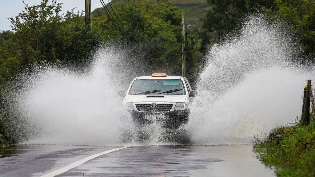 Motorists make their way through flooded roads on Thursday near Dunmanway in Co Cork following Storm Ellen. Photograph:  Damien Storan/PA Wire