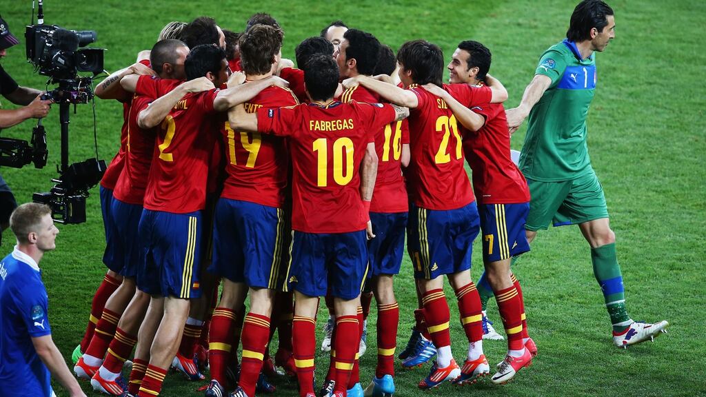Spanish players celebrate victory over Italy in the 2012 UEFA European Championship final in Kiev, Ukraine, as Italian goalkeeper Gianluigi Buffon walks by. Photograph: Martin Rose/Getty Images