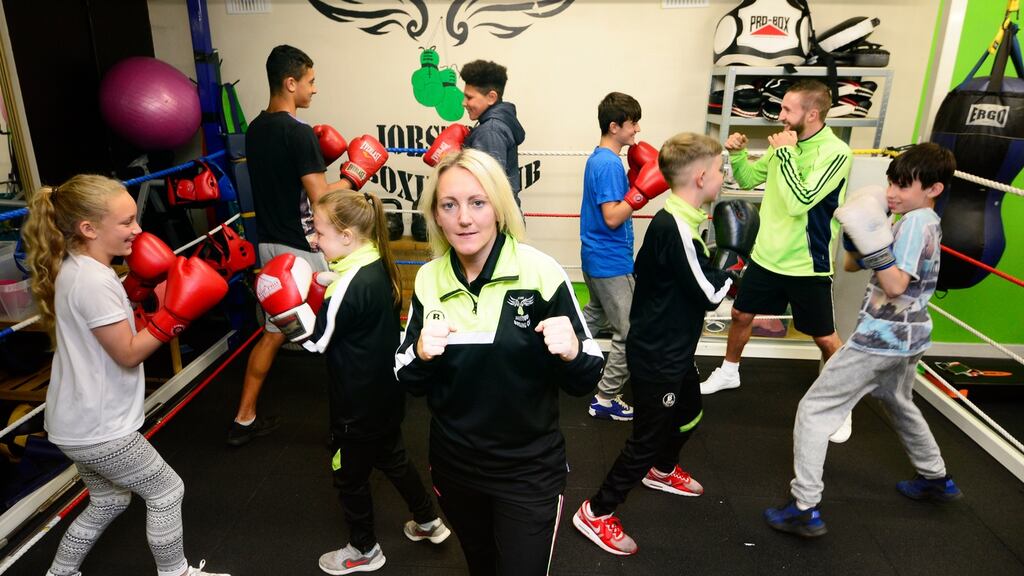 Amanda Spencer, head coach with Jobstown Boxing Club, with Tiffany Spencer, Ava Mc Cabe, Joshua O Laniyan and his brother Adam, Brandon Hall, JJ Marshall, Ryan Dunne and James Gray coach. Photograph: Cyril Byrne