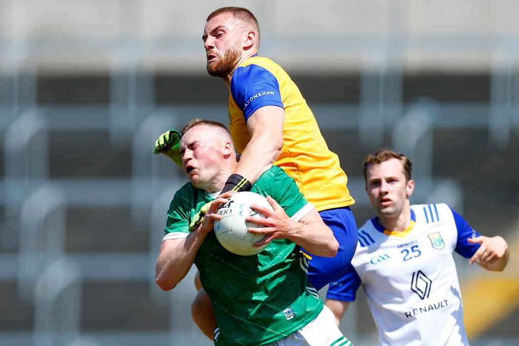 Mark Jackson of Wicklow fouls Hugh Bourke of Limerick to concede a penalty during the Tailteann Cup match at Laois Hire O'Moore Park. Photograph: Ashley Cahill/Inpho