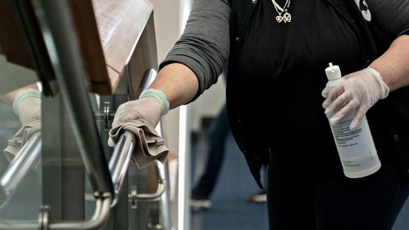 Cleaning a railing with disinfectant at the Washington Convention Center in Washington, DC. Photograph: Andrew Harrer/Bloomberg