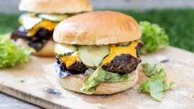 Beef burger with dill sauce, pickles and cheese