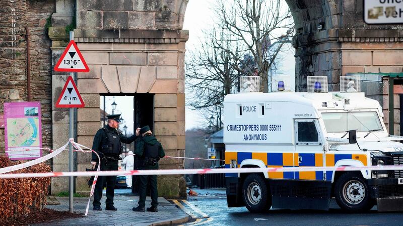 Poice Officers and police forensic officers work at the scene in the aftermath of a suspected car bomb explosion in Derry. Photograph: Paul Faith/AFP/Getty Images