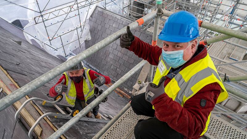 Dean of St Patrick’s Cathedral Dr William Morton at the installation of the final roof slate on the cathedral in May 2021 as part of its renovation project. Photograph: Marc O’Sullivan