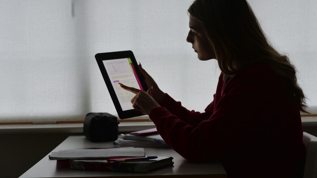 A student using an iPad for her school work. The Stavanger Declaration, the culmination of a five-year study, states that an indiscriminate swap of traditional hardcopy textbooks for digital materials does not work. Photograph: Alan Betson
