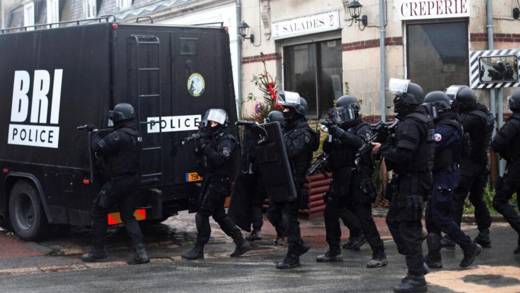 Riot officers patrol in Longpont, north of Paris. The suspects were were identified by a petrol station attendant in the town of Villers-Cotterets, 70km northeast of the French capital. Photograph: Thibault Camus/AP
