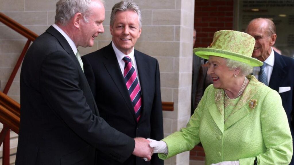 Queen Elizabethshakes hands with Deputy First Minister  Martin McGuinness watched by First Minister Peter Robinson  in Belfast in 2012. A quarter of a century earlier, MP Jim Kilfedder sought her direct involvement in talks on the North’s future. Photograph: Paul Faith/WPA Pool/Getty Images