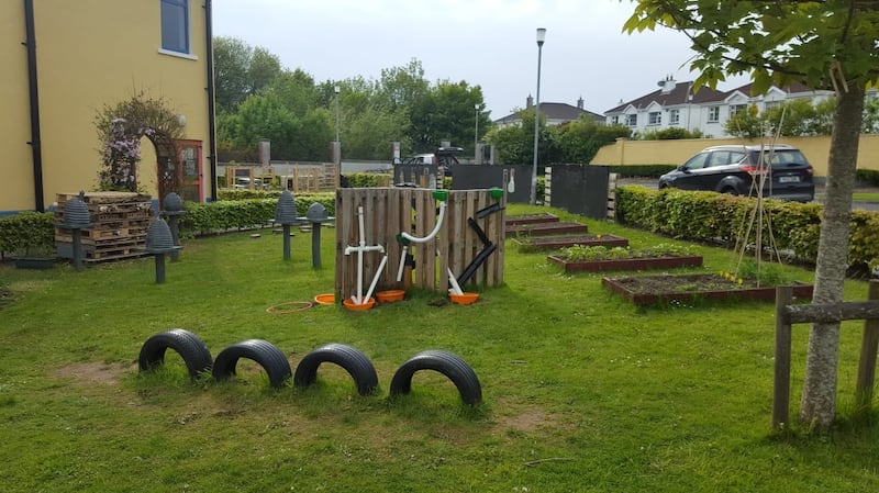 Tyres, raised beds and chalk boards featre in the outdoor learning space at Knocknacarra National School in Galway.