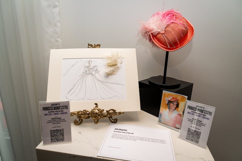 A display including Princess Diana's peach straw archer-style hat by John Boyd. Photograph: Aaron Chown/PA Photos