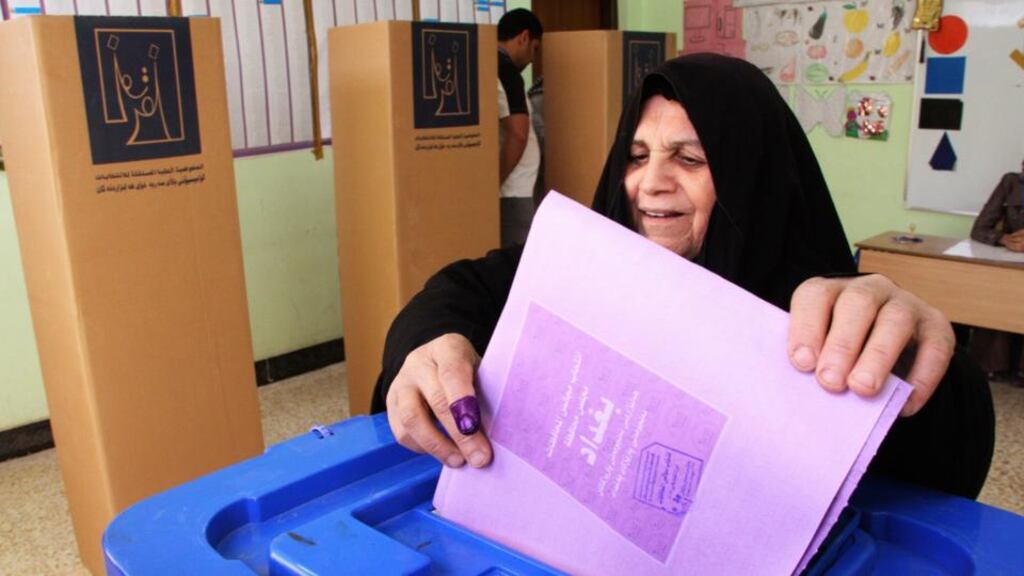 A woman casts her vote at a polling station during the provincial elections in Baghdad on Saturday. Fourteen million Iraqis were eligible to vote in 12 of the country’s 18 provinces. Photograph: Reuters/Wissm al-Okili