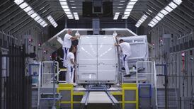 VW brand profit plunges but Porsche lifts group