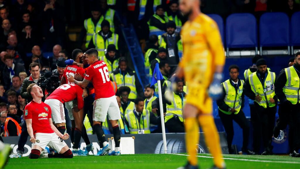 Manchester United’s Marcus Rashford celebrates with Scott McTominay and teammates after scoring the winner in the Carabao Cup fourth round clash with Chelsea. Photo: Eddie Keogh/Reuters