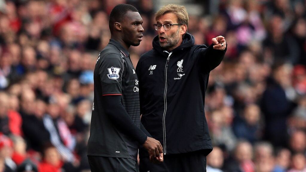Liverpool manager Jürgen Klopp speaks to Christian Benteke as he prepares to come on during the Premier League defeat to Southampton at St Mary’s on Sunday. Photograph: PA.