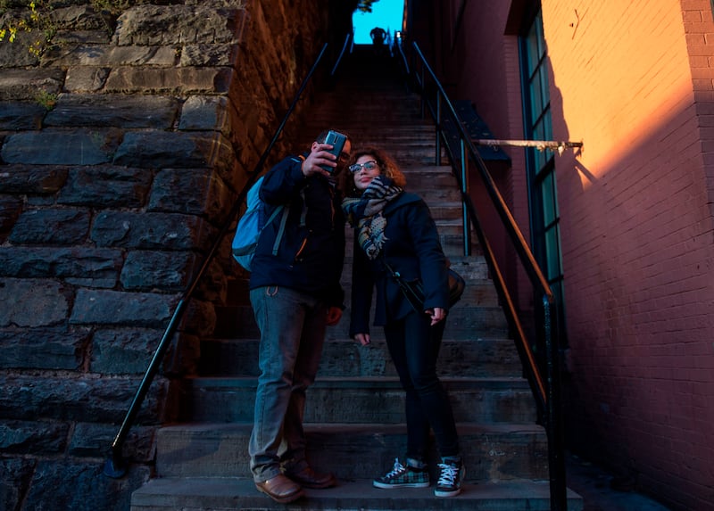 Tourists pose on the steps made famous by The Exorcist. Photograph: Andrew Caballero-Reynolds/Getty