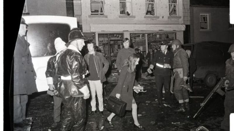A doctor walks through soldiers at the scene in Belturbet, Co Cavan, following the bombing in December 1972. Photograph: Paddy Ronaghan