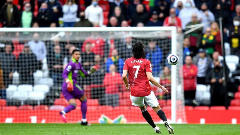 Manchester United’s Edinson Cavani scores his side’s opener against Fulham. Photograph: Paul Ellis/PA