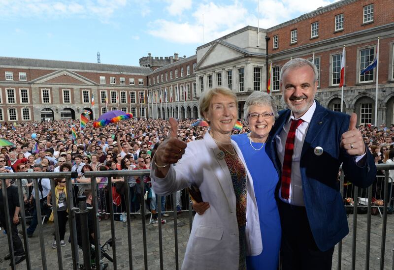 'Pure joy': Ann Louise Gilligan, Katherine Zappone and Colm O’Gorman celebrating in front of the crowds at Dublin Castle. Photograph: Dara Mac Dónaill/The Irish Times