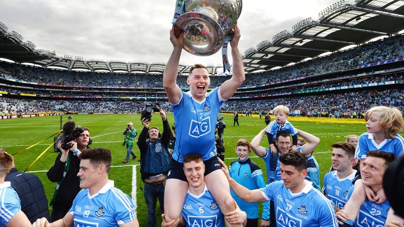 Philly McMahon on the shoulders of John Small as Dublin celebrate the nerve-jangling one point victory over Mayo in the All-Ireland final. Photograph: Dara Mac Dónaill