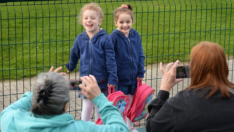 Twins Daphne and Jasmine Alecsandrescu, arriving for their first day at school in Balbriggan Educate Together. Photograph: Dara Mac Dónaill/The Irish Times