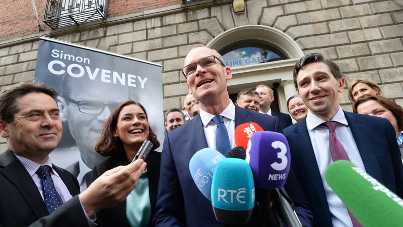 Simon Coveney at the Fine Gael headquarters on Mount Street with Kate O’Connell and Simon Harris where he announced his run for leadership of the party. Photograph: Cyril Byrne/The Irish Times