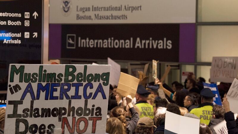 People protest at the International arrivals of Boston’s Logan International Airport after people arriving from Muslim-majority countries were held at the border control. Photograph: EPA