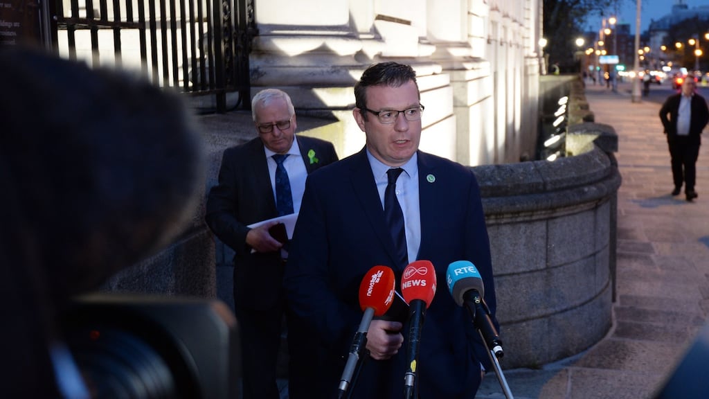 Labour Party leader Alan Kelly with Mattie McGrath (background)   leaving Government Buildings on Friday afternoon. Photograph: Alan Betson / The Irish Times