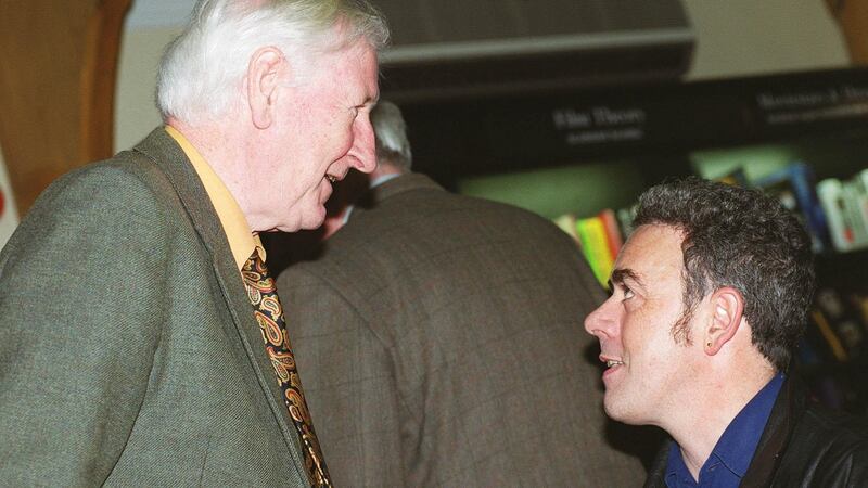 John Montague with Theo Dorgan from  at a poetry reading by  Dennis O’Driscoll and Thomas McCarthy in Waterstones Bookshop in 2011. Photograph: Alan Betson