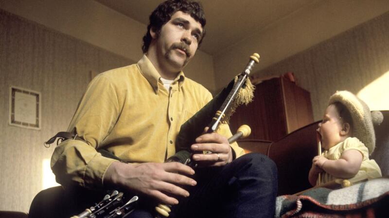 Finbar Furey playing the uilleann pipes to his daughter in the late 1960s. Photograph: Brian Shuel/Redferns