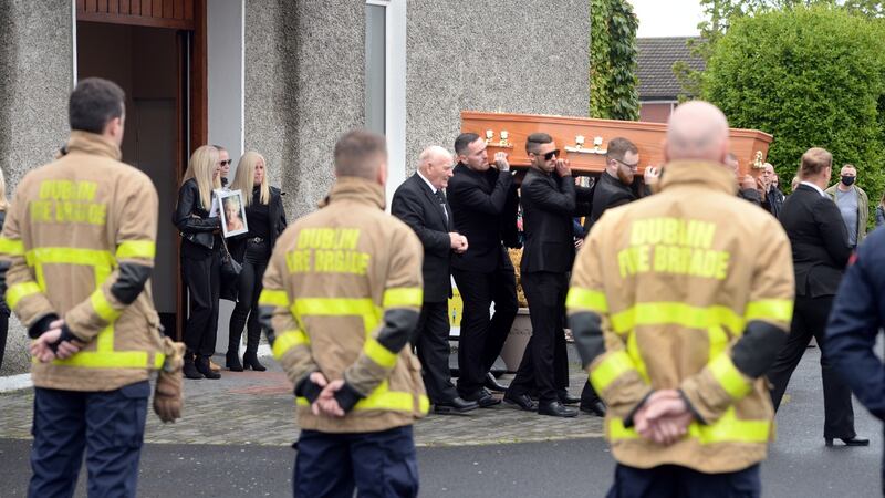 Dublin fire brigade members form a guard of honour following the funeral of Christine Keegan at Bonnybrook Parish, St Joseph the Artisan Church, Dublin. Photograph: Dara Mac Donaill/The Irish Times