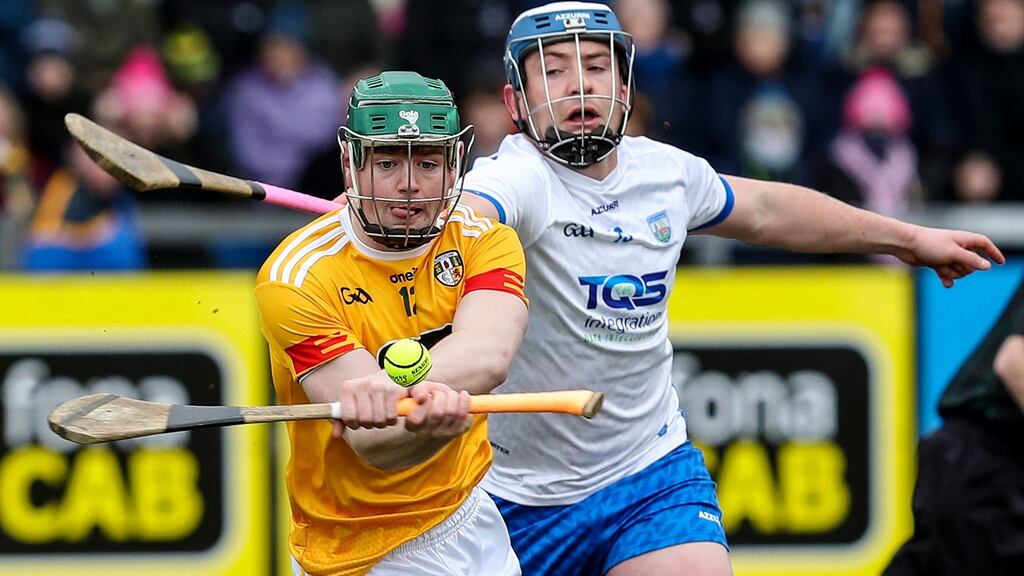 Antrim’s Conal Cunning with Stephen Bennett of Waterford during the hurling league clash at Corrigan Park. Photograph: Declan Roughan/Inpho