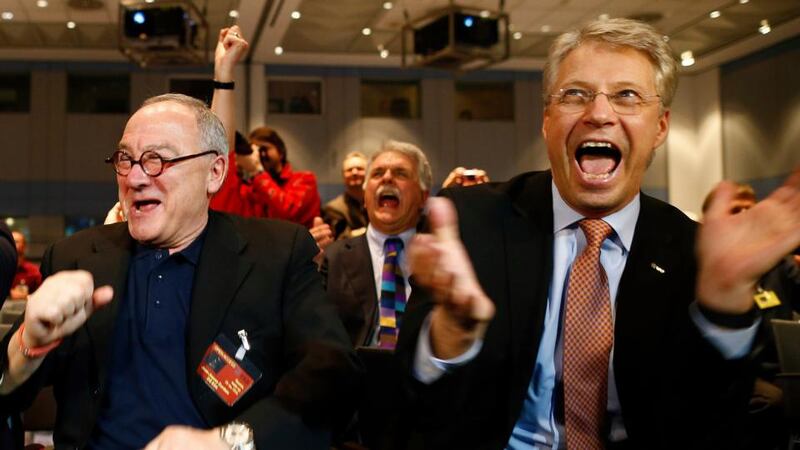 European Space Agency (ESA) director general Jean-Jacques Dordain (left) and European Space Operations Centre (ESOC) director general Thomas Reiter react after ESA’s satellite Rosetta resent a signal to ESOC in Darmstadt. Photograph: Ralph Orlowski/Reuters