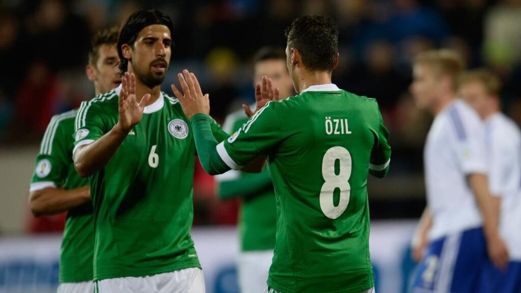 Mesut Özil of Germany celebrates with teammates after scoring his team’s second against Faroe Islands in Torshavn. Photograph: Dennis Grombkowski/Bongarts/Getty Images