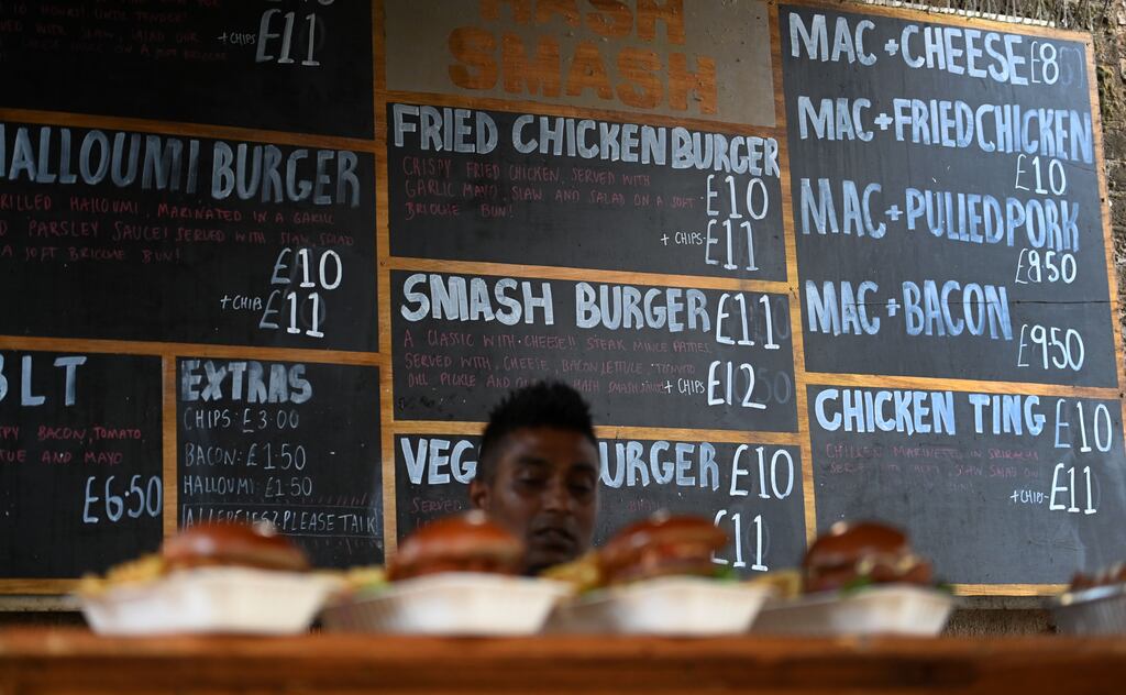 Burger prices on display boards at a market in London. Goldman Sachs on Monday said UK inflation could exceed 20 per cent by the start of 2023 if gas costs remain highly elevated. Photograph: Andy Rain/EPA