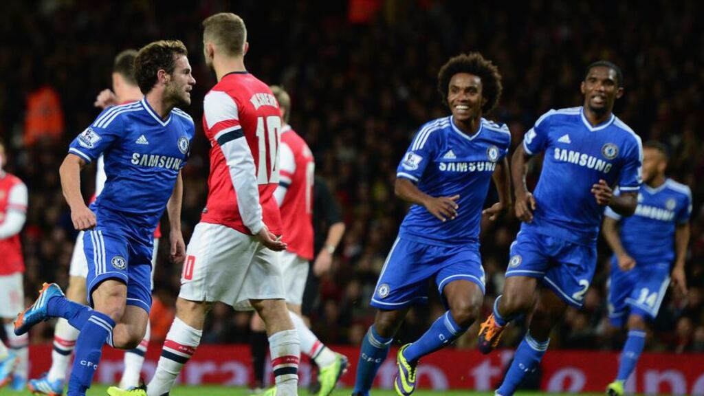 Juan Mata of Chelsea celebrates after scoring his side’s second goal during the League Cup fourth round match against Arsenal at the Emirates Stadium last night. Photograph: Jamie McDonald/Getty Images