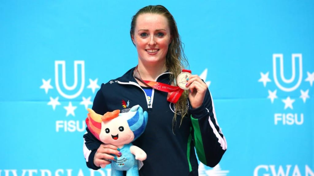 Fiona Doyle shows off the silver medal she won in the 50m breaststroke at the World University Games in Gwangju.