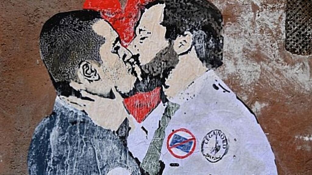 A mural in Rome depicting Five-Star Movement leader Luigi Di Maio kissing League leader Matteo Salvini in the context of their striking a deal. Photograph: Tiziana Fabi/AFP/Getty Images