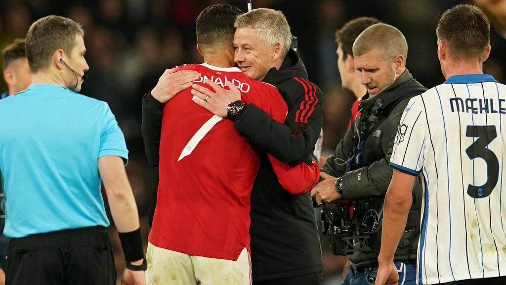 Manchester United manager Ole Gunnar Solskjaer hugs Cristiano Ronaldo after the Champions League Group F win over Atalanta. Photo: Dave Thompson/AP Photo