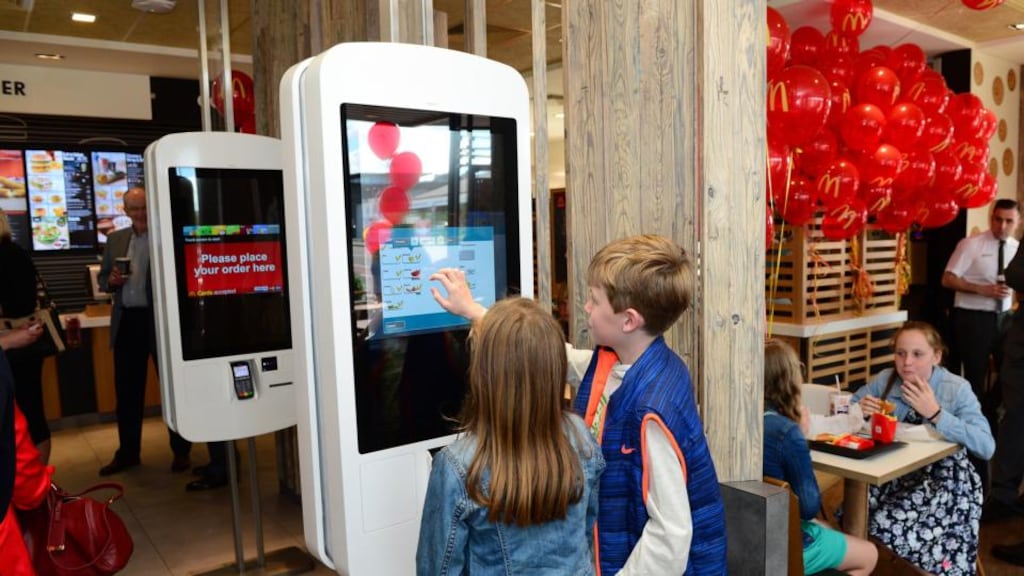 Rachel and Michael O’Donovan, from Bandon, using a touchscreen  to order at the Musgrave Park McDonald’s in Cork. Photograph: Domnick Walsh