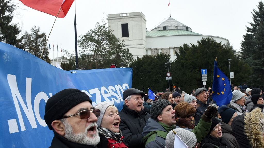People at the anti-government demonstration in front of the Polish parliament in Warsaw on December 20th. Photograph: Janek Skarzynski/AFP/Getty